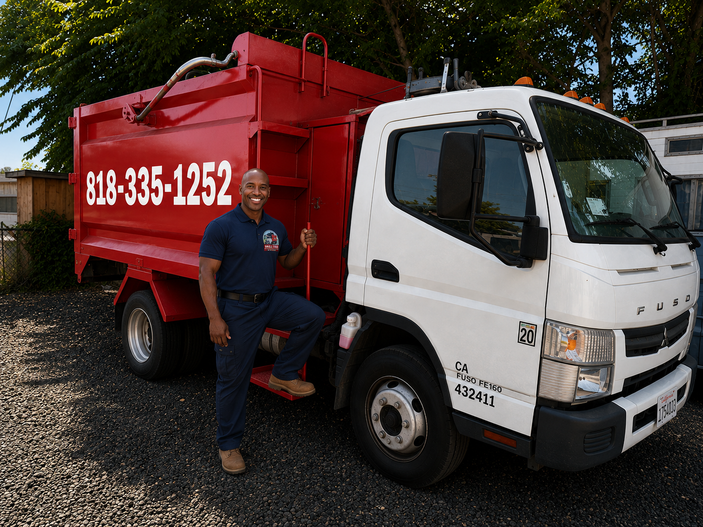 Small Time Hauling crew member on the side step of a fully loaded dump truck